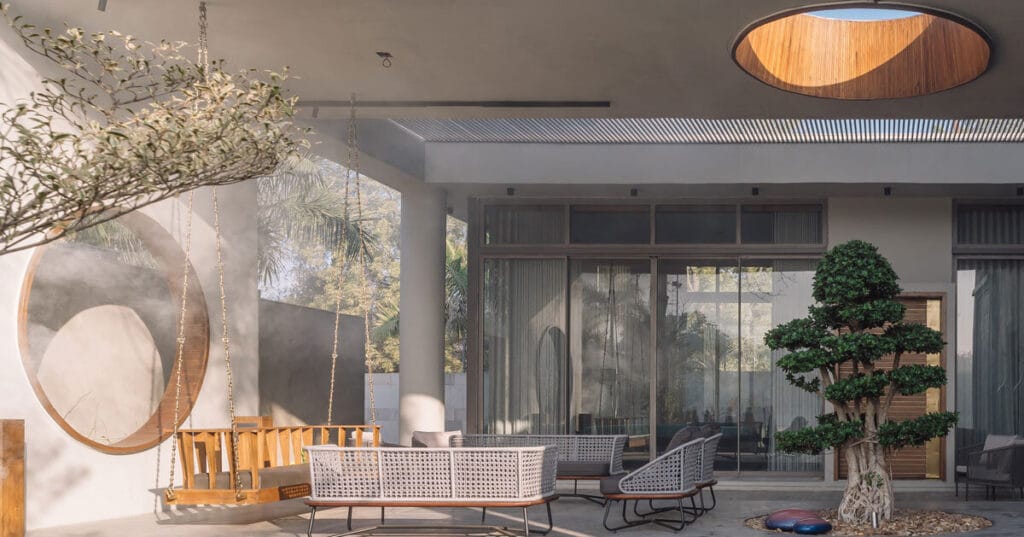 circular wooden apertures puncture through residence by UA lab in india