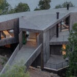 cazú zegers stacks shifting stone blocks to form PYR house in chile
