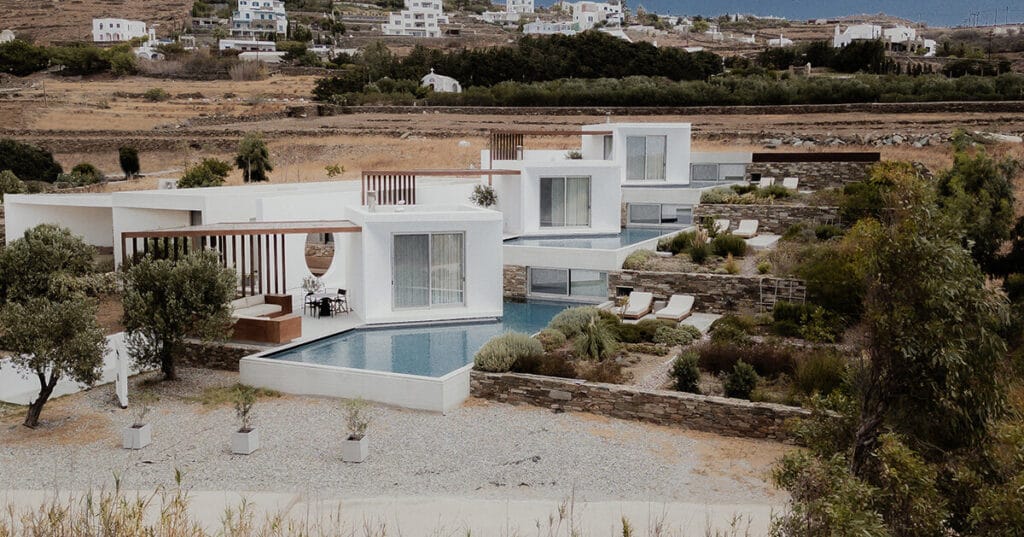 cubic volumes emerge from tinos’ rugged terrain in ‘pnoes’ hotel by aristides dallas architects