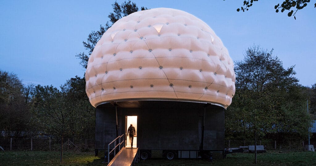 mobile sleeping hut combines stainless steel trailer with double-shell inflatable dome