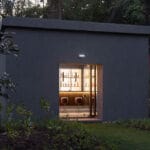 elmgreen & dragset’s six-seat bar pavilion appears like a mirage in thai art forest