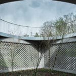 perforated facade encloses courtyard within family house in zagreb