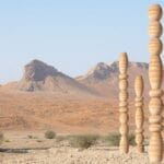 karim + elias’ desert relics installation rises like totems in UAE