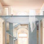 light blue steel structure by caarpa transforms historic italian church into event hall