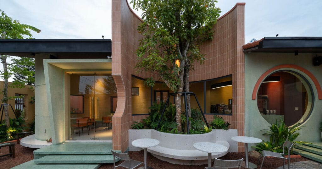 red brick wall encircles minji cake bakery’s garden in vietnam