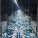 AMO surrounds prada FW25 set design with scaffolding structures