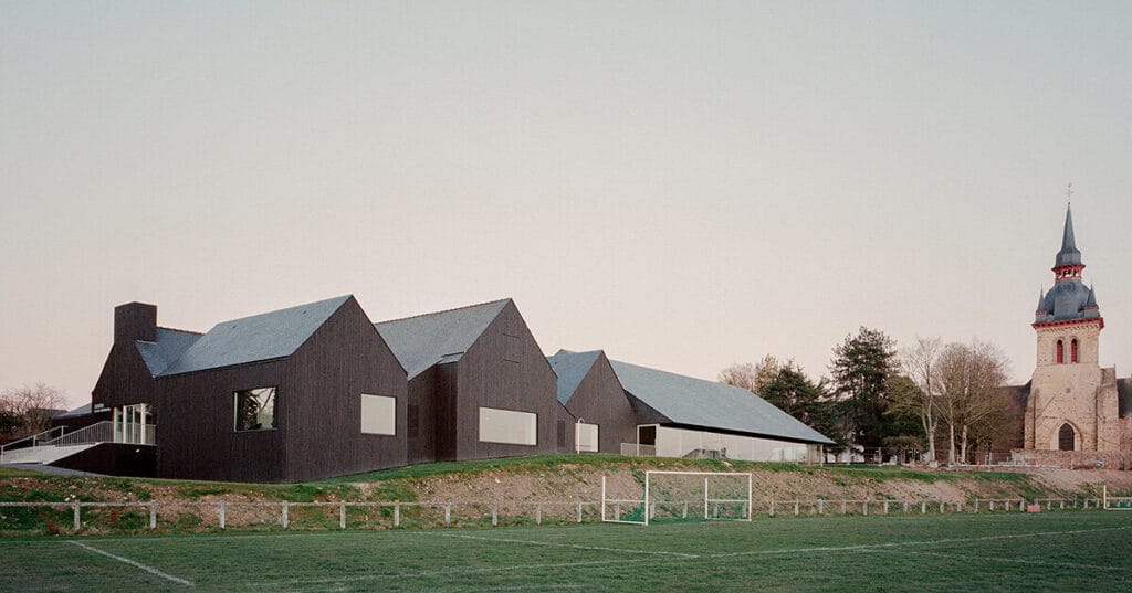 raum envelops renovated brittany pool and spa in black timber skin for thermal insulation