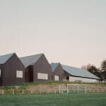 raum envelops renovated brittany pool and spa in black timber skin for thermal insulation