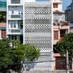 sanuki daisuke architects redefines vietnamese tube house with rhythmic light steel shades