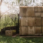 second-hand materials shape compact sauna by ika.architekti inside czech garden