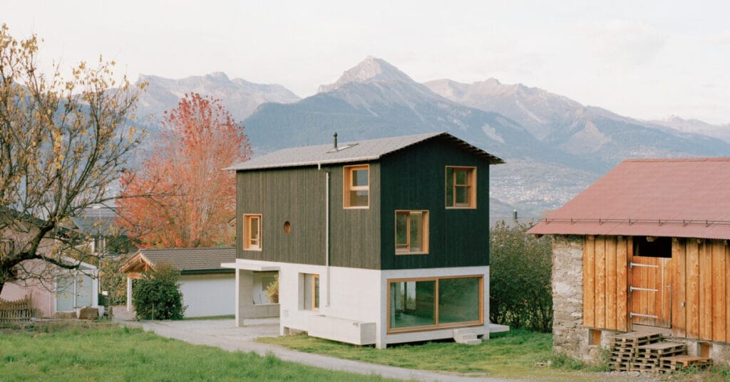 lionel ballmer architectes’ wood house echoes barns of switzerland