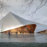 bjarke ingels group drapes undulating roof over opera theater of kosovo