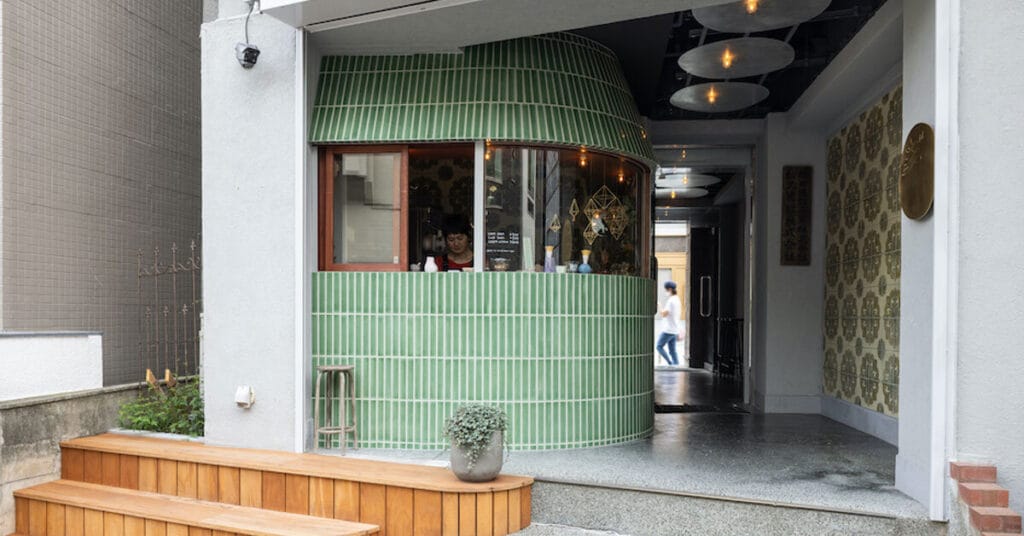 mint green tiles wrap tiny curved ice cream shop by uenoa in tokyo