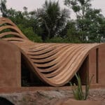 perforated curved wall acts as climatic buffer at VY architecture studio’s india residence