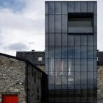 transparent lighthouse by barthélémy griño extends whisky distillery in scotland