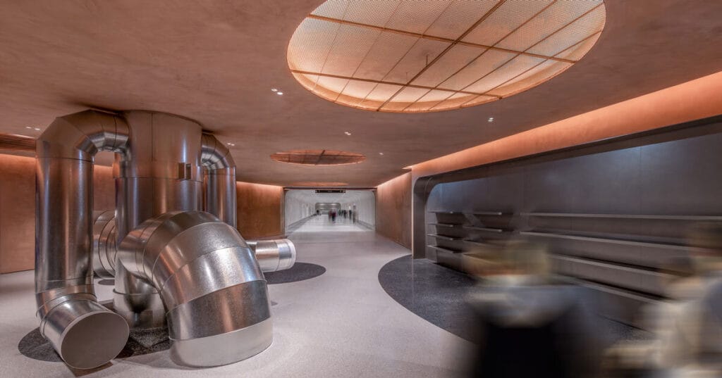 steel pipes run through brewery’s linear interior by AIM in shenzhen