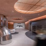 steel pipes run through brewery’s linear interior by AIM in shenzhen