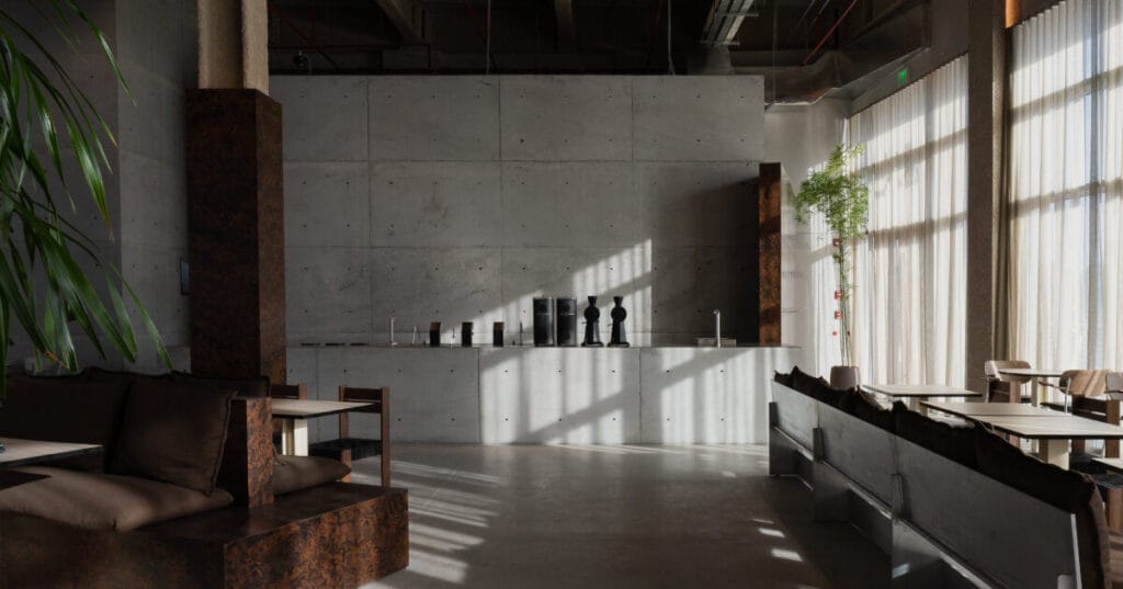 shell+core’s cafe in abu dhabi embraces wabi-sabi and brutalism