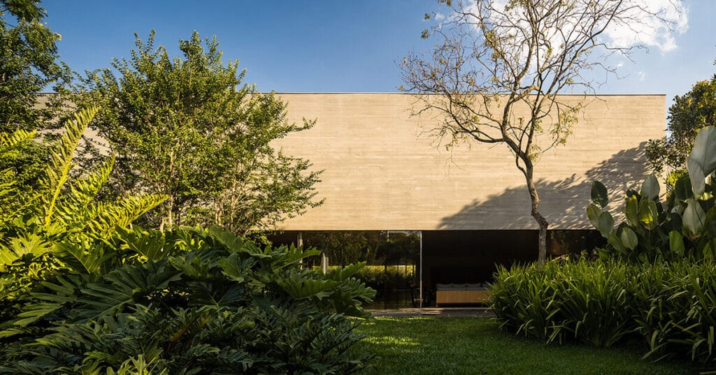studio MK27’s monolithic concrete house unfolds onto tropical garden in são paulo