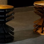 salù iwadi studio layers spiraling wooden fins to form zangbeto side table